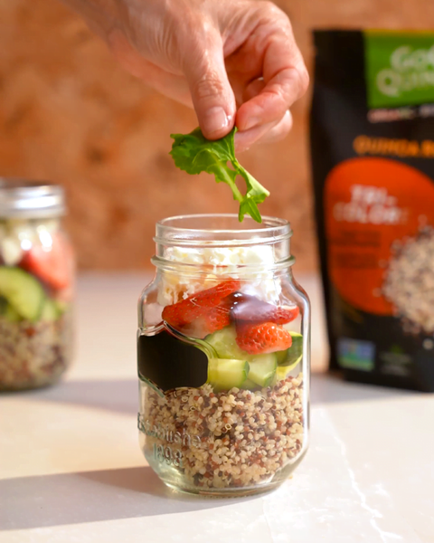 Strawberry quinoa salad with cucumbers, feta and basil in a mason jar