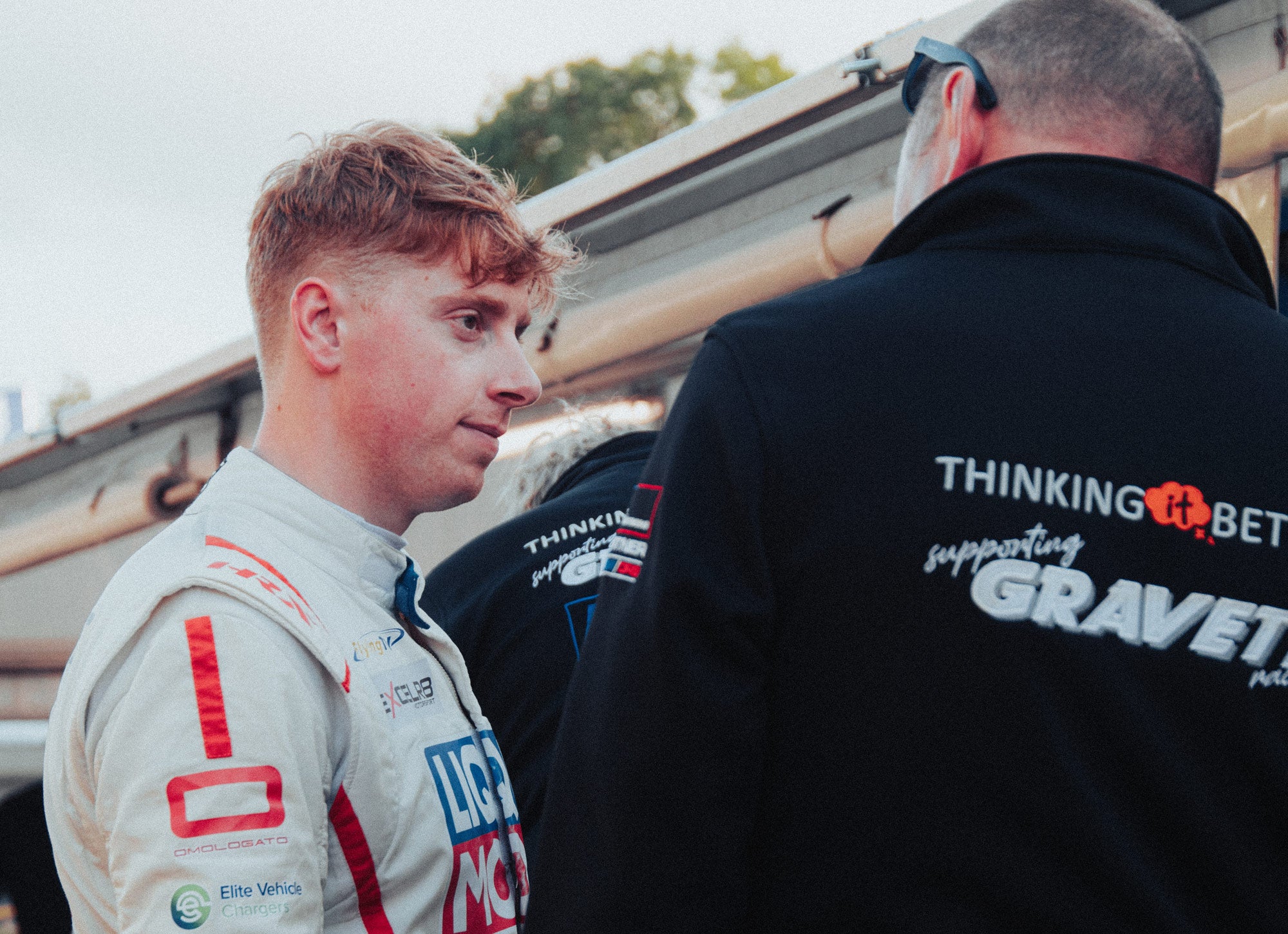 Bradley Gravett son of BTCC British Touring Car Champion Robb Gravett in the MINI Challenge JCW Series 2022 Driving at Brands Hatch GP Brad talking to Ian Travers from Thinking it Better EXCELR8 Motorsport LIQUI MOLY LM Performance Scalextric