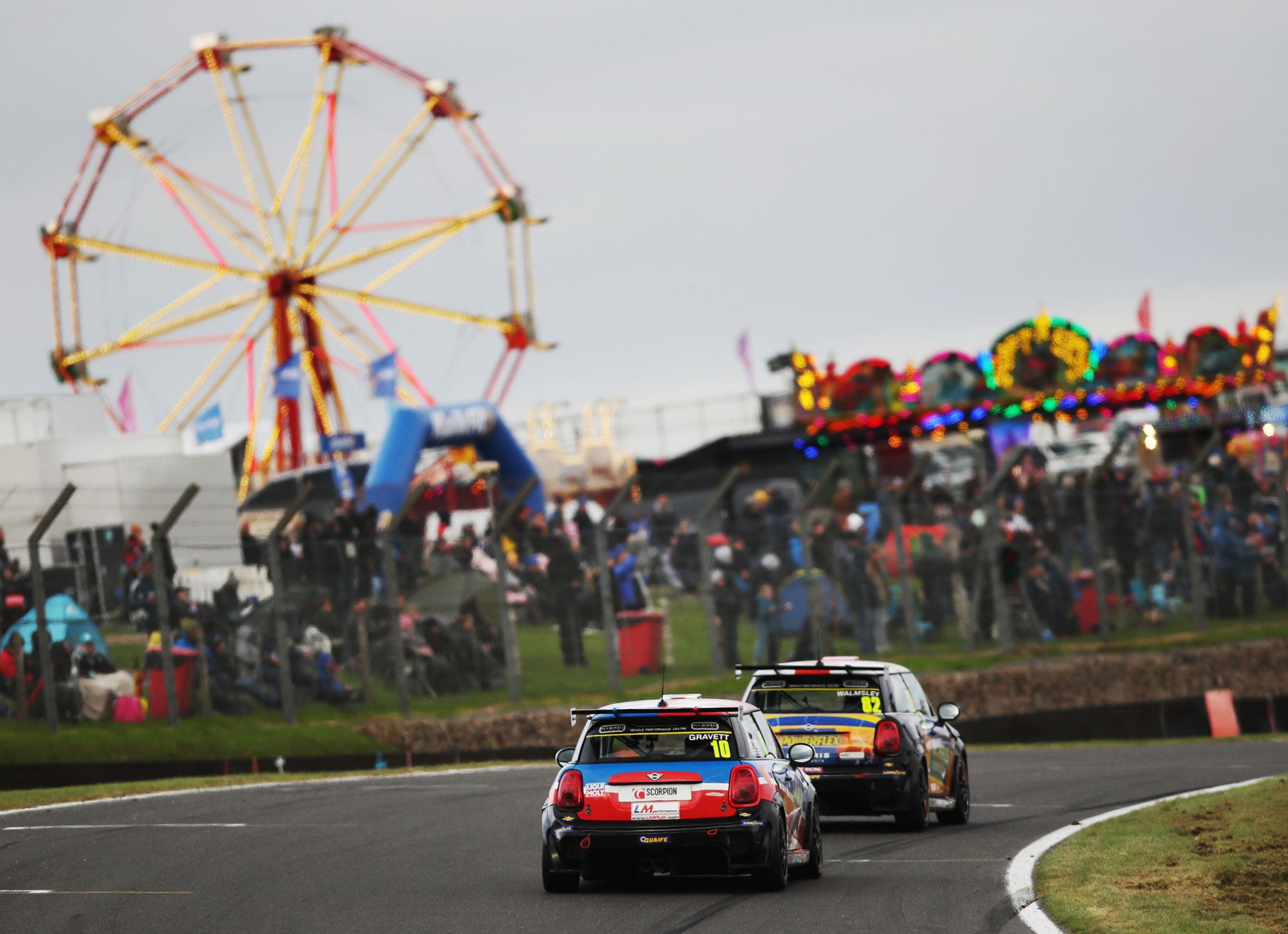 Bradley Gravett son of BTCC British Touring Car Champion Robb Gravett in the MINI Challenge JCW Series at Brands Hatch GP in 2021 On Pit Straight with Huge BTCC Crowds Graves Motorsport Cooper Racing Driver LIQUI MOLY LM Performance