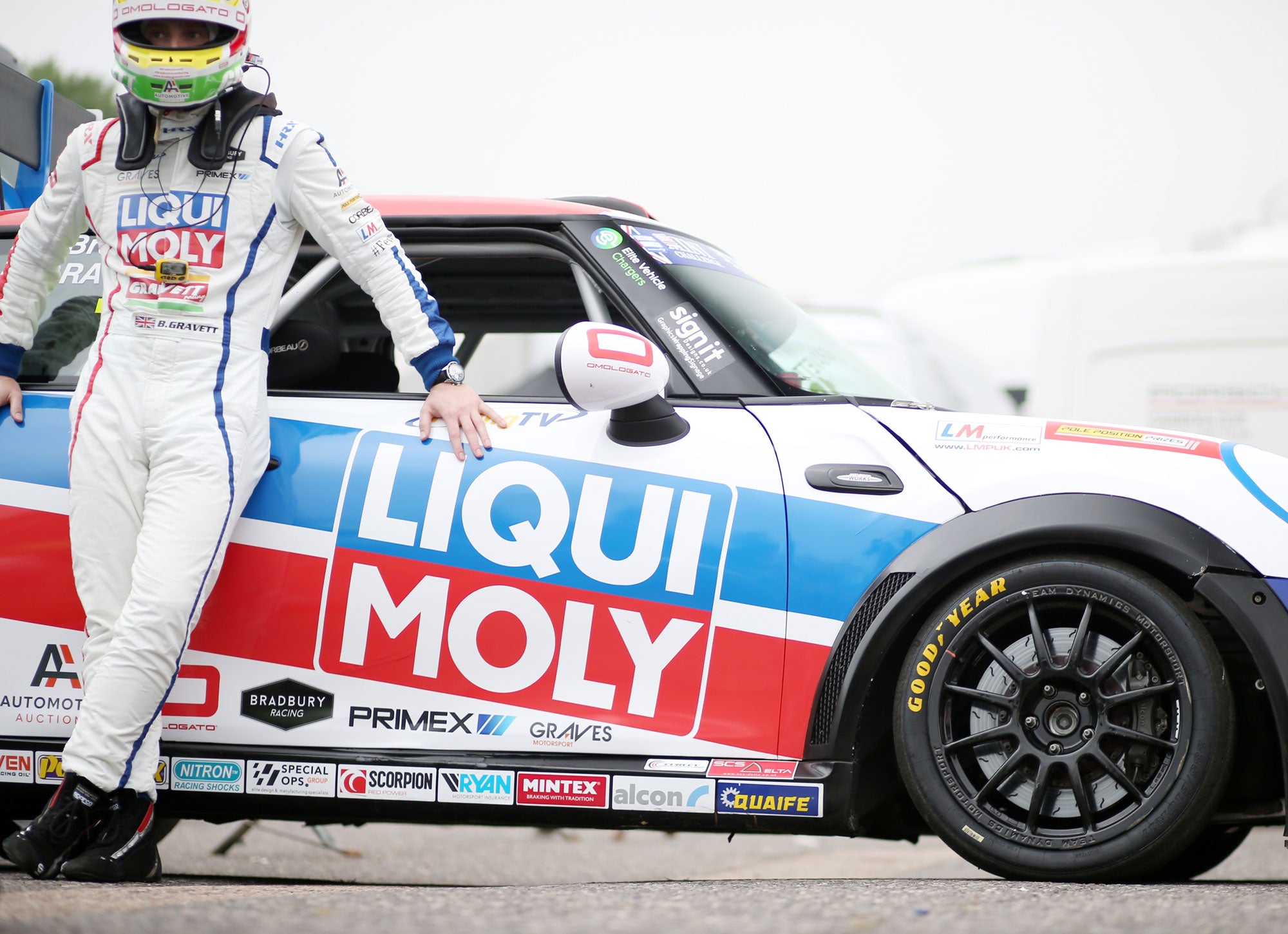 Bradley Gravett son of BTCC British Touring Car Champion Robb Gravett in the MINI Challenge JCW Series at Brands Hatch Indy in 2021 Standing by Car in Assembly Area Graves Motorsport Cooper Racing Driver LIQUI MOLY LM Performance Thinking it Better