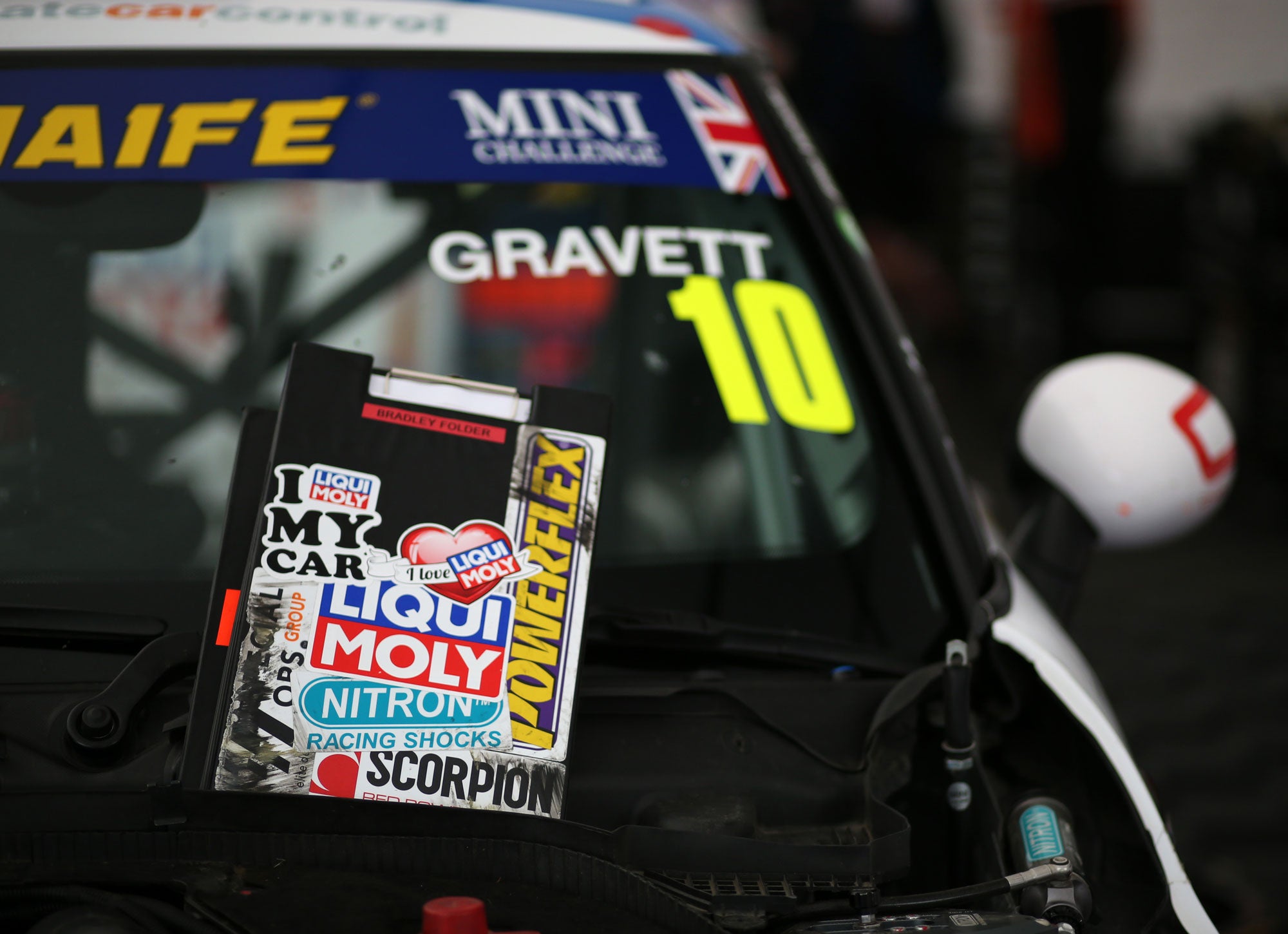 Bradley Gravett son of BTCC British Touring Car Champion Robb Gravett in the MINI Challenge JCW Series at Brands Hatch Indy in 2021 with Sticker Clipboard Graves Motorsport Cooper Racing Driver LIQUI MOLY LM Performance Thinking it Better