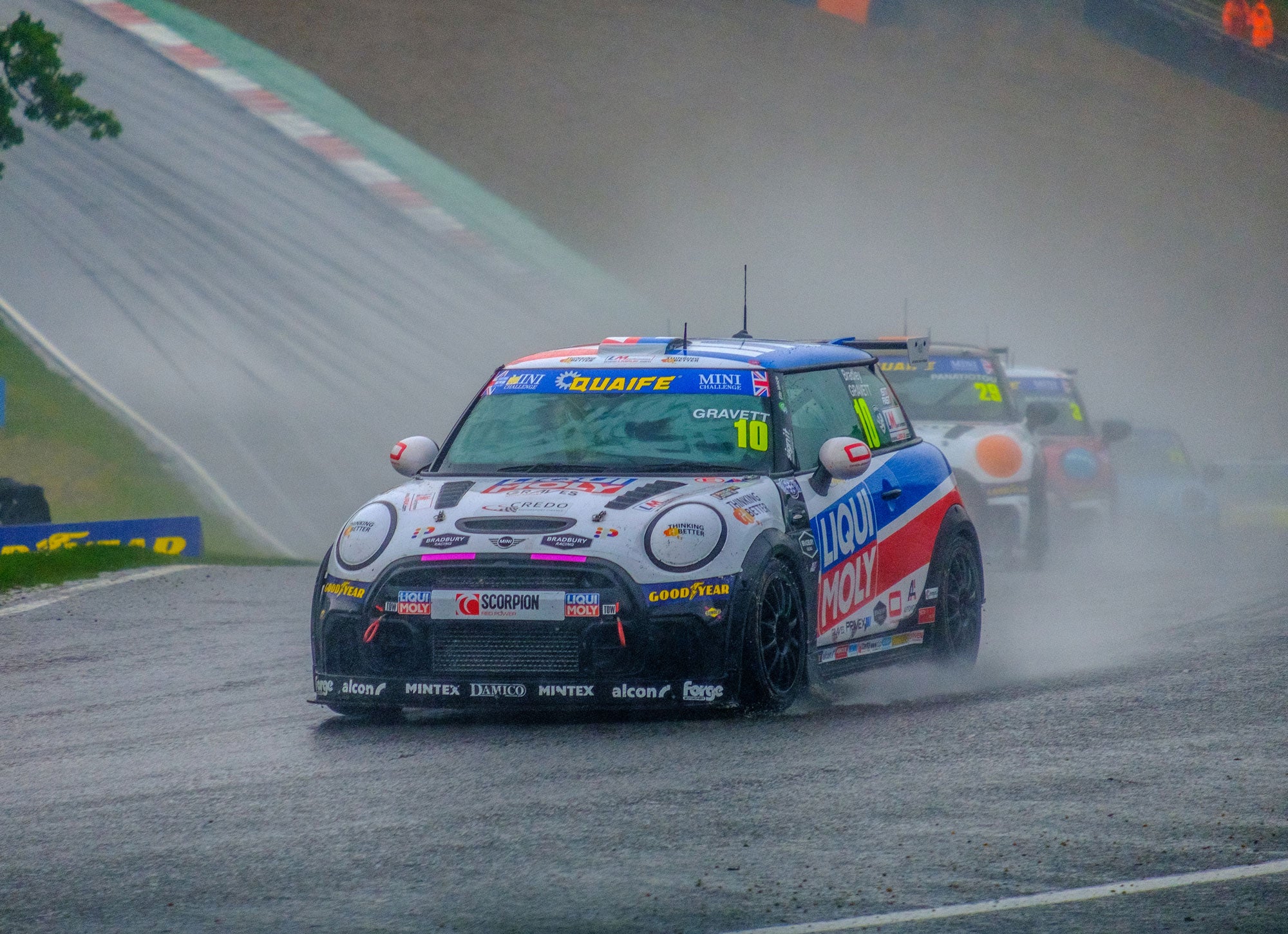 Bradley Gravett son of BTCC British Touring Car Champion Robb Gravett in the MINI Challenge JCW Series at Brands Hatch Indy in 2022 Entry to Druids in the Wet with a Very Misted Screen Graves Motorsport Cooper Racing Driver LIQUI MOLY