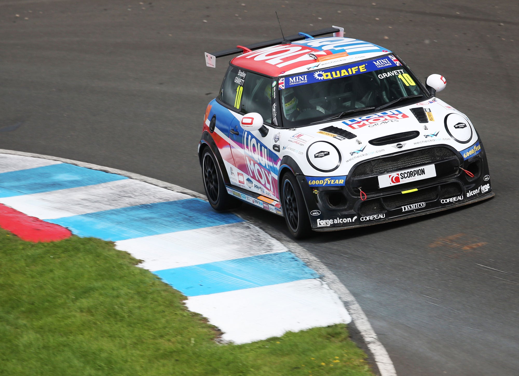 Bradley Gravett son of BTCC British Touring Car Champion Robb Gravett in the MINI Challenge JCW Series at Knockhill in 2021 Exit of Turn 1 Graves Motorsport Cooper Racing Driver LIQUI MOLY LM Performance Thinking it Better