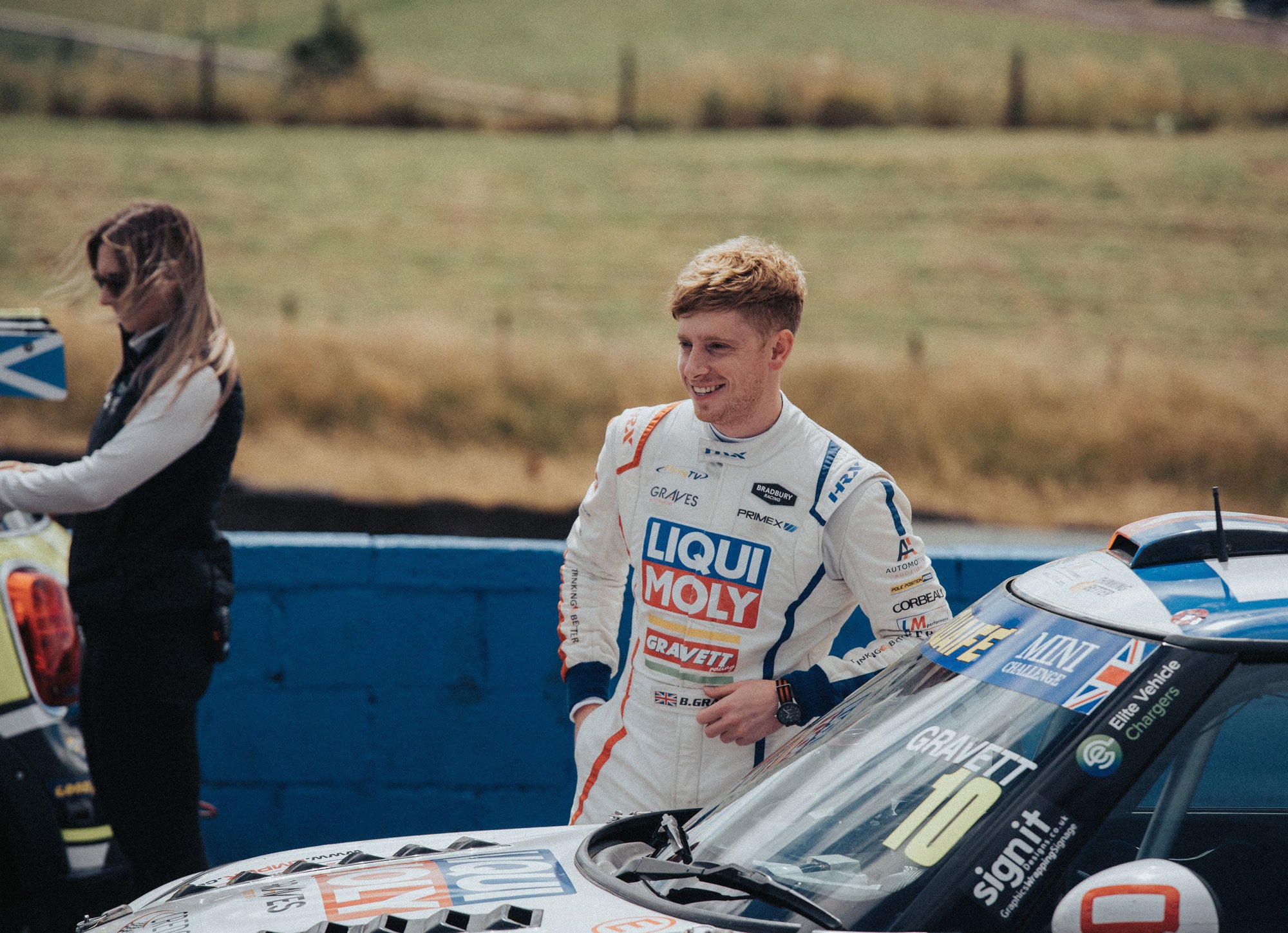 Bradley Gravett son of BTCC British Touring Car Champion Robb Gravett in the MINI Challenge JCW Series at Knockhill in 2022 Bradley Getting Ready in Assembly Area Graves Motorsport Cooper Racing Driver LIQUI MOLY LM Performance Thinking it Better