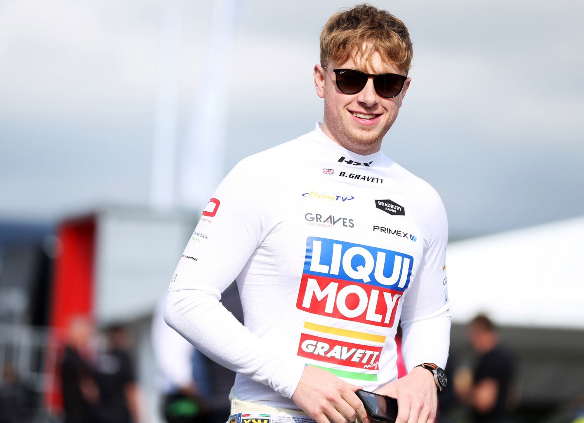 Bradley Gravett son of BTCC British Touring Car Champion Robb Gravett in the MINI Challenge JCW Series at Knockhill in 2022 Bradley Smiling at Camera Graves Motorsport Cooper Racing Driver LIQUI MOLY LM Performance Thinking it Better