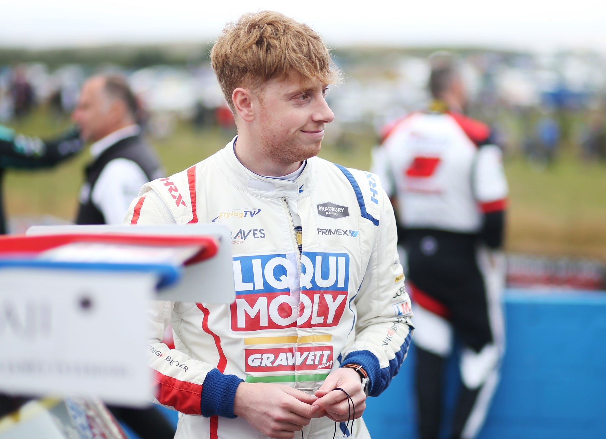 Bradley Gravett son of BTCC British Touring Car Champion Robb Gravett in the MINI Challenge JCW Series at Knockhill in 2022 Smiling in Assembly Area Graves Motorsport Cooper Racing Driver LIQUI MOLY LM Performance Thinking it Better