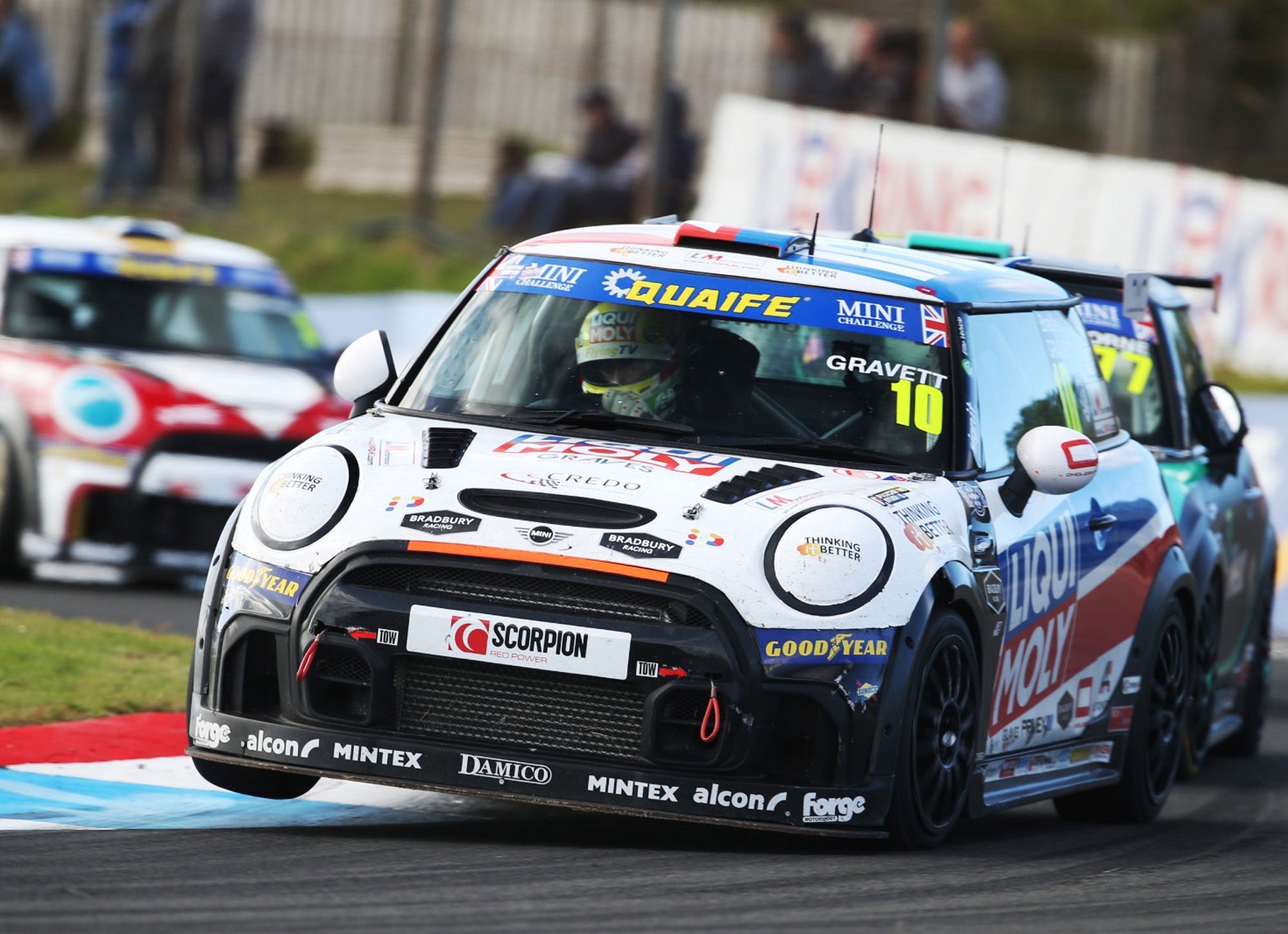 Bradley Gravett son of BTCC British Touring Car Champion Robb Gravett in the MINI Challenge JCW Series at Knockhill in 2022 Turn 3 on 2 Wheels on The Curb Graves Motorsport Cooper Racing Driver LIQUI MOLY LM Performance Thinking it Better