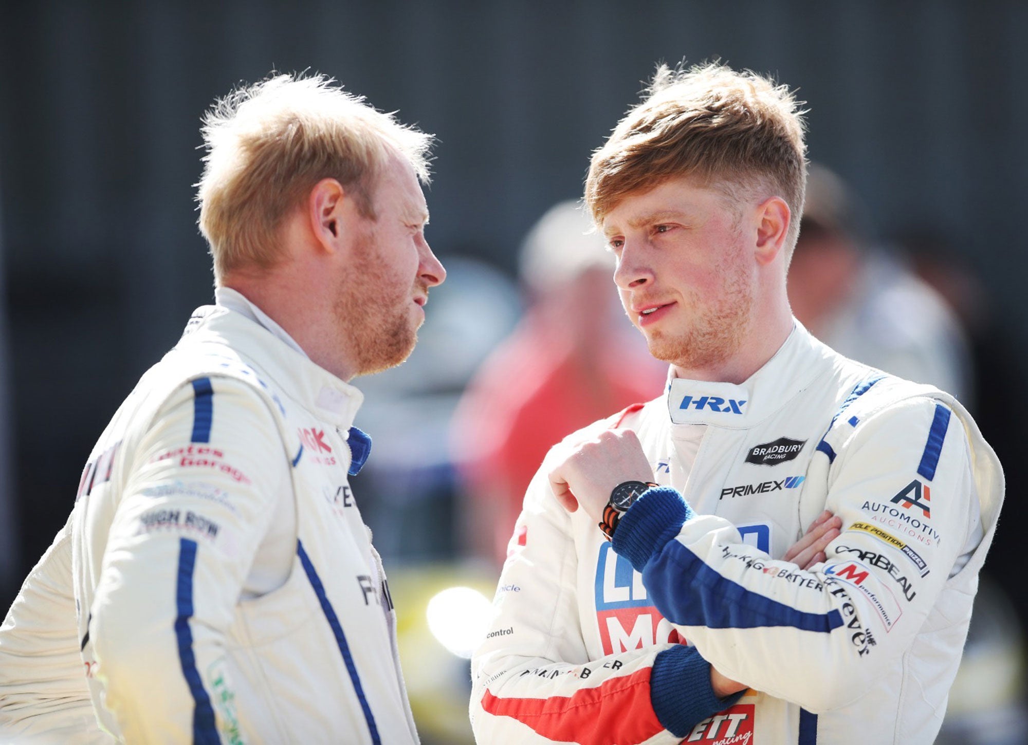 Bradley Gravett son of BTCC British Touring Car Champion Robb Gravett in the MINI Challenge JCW Series at Oulton Park in 2022 Bradley Talking to Max Coates Graves Motorsport Cooper Racing Driver LIQUI MOLY LM Performance Thinking it Better