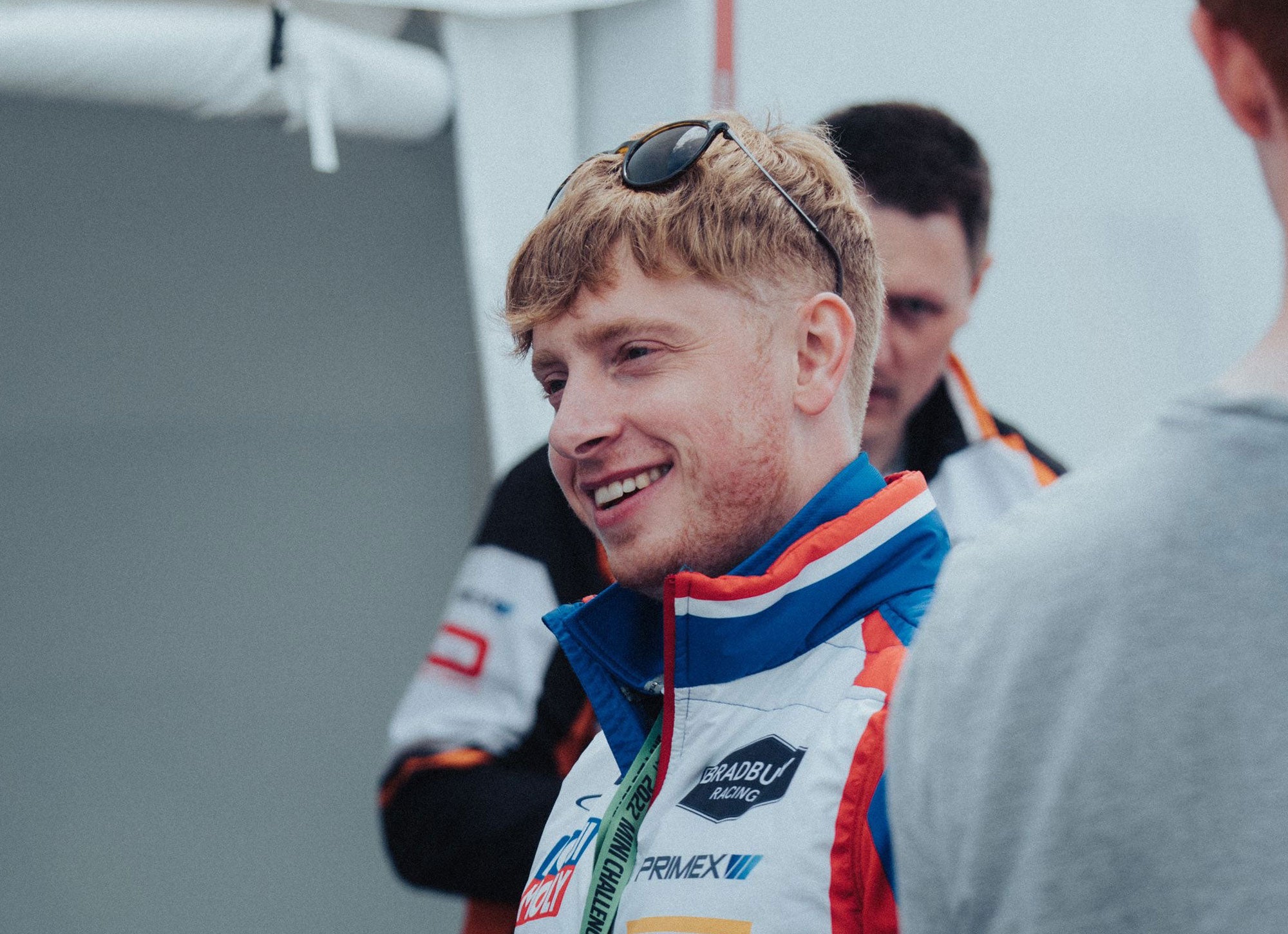 Bradley Gravett son of BTCC British Touring Car Champion Robb Gravett in the MINI Challenge JCW Series at Oulton Park in 2022 Smiling at Camera Graves Motorsport Cooper Racing Driver LIQUI MOLY LM Performance Thinking it Better