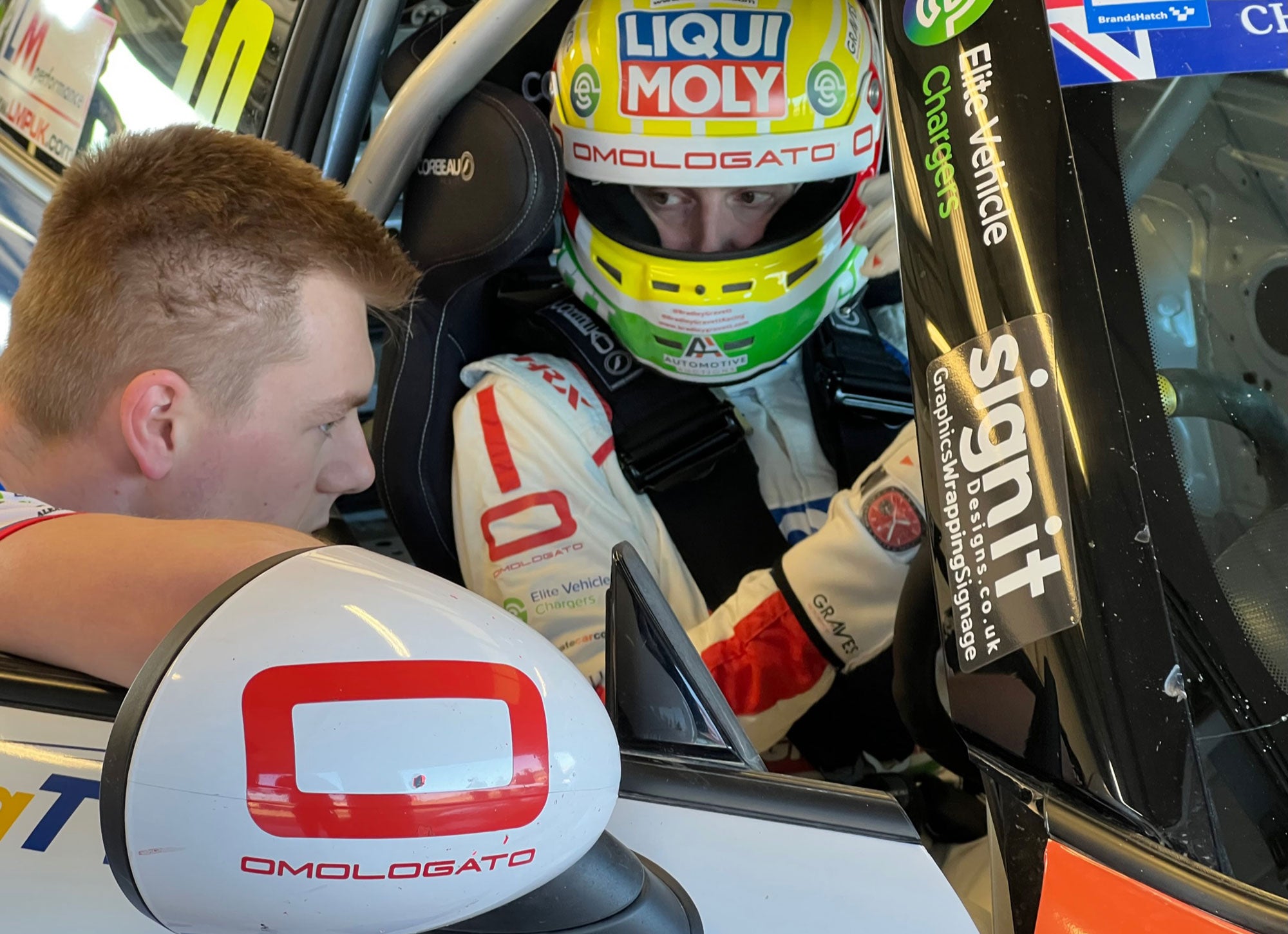 Bradley Gravett son of BTCC British Touring Car Champion Robb Gravett in the MINI Challenge JCW Series at Silverstone National Tyre Test in 2022 Talking to Lewis Perry Graves Motorsport Cooper Racing Driver LIQUI MOLY LM Performance