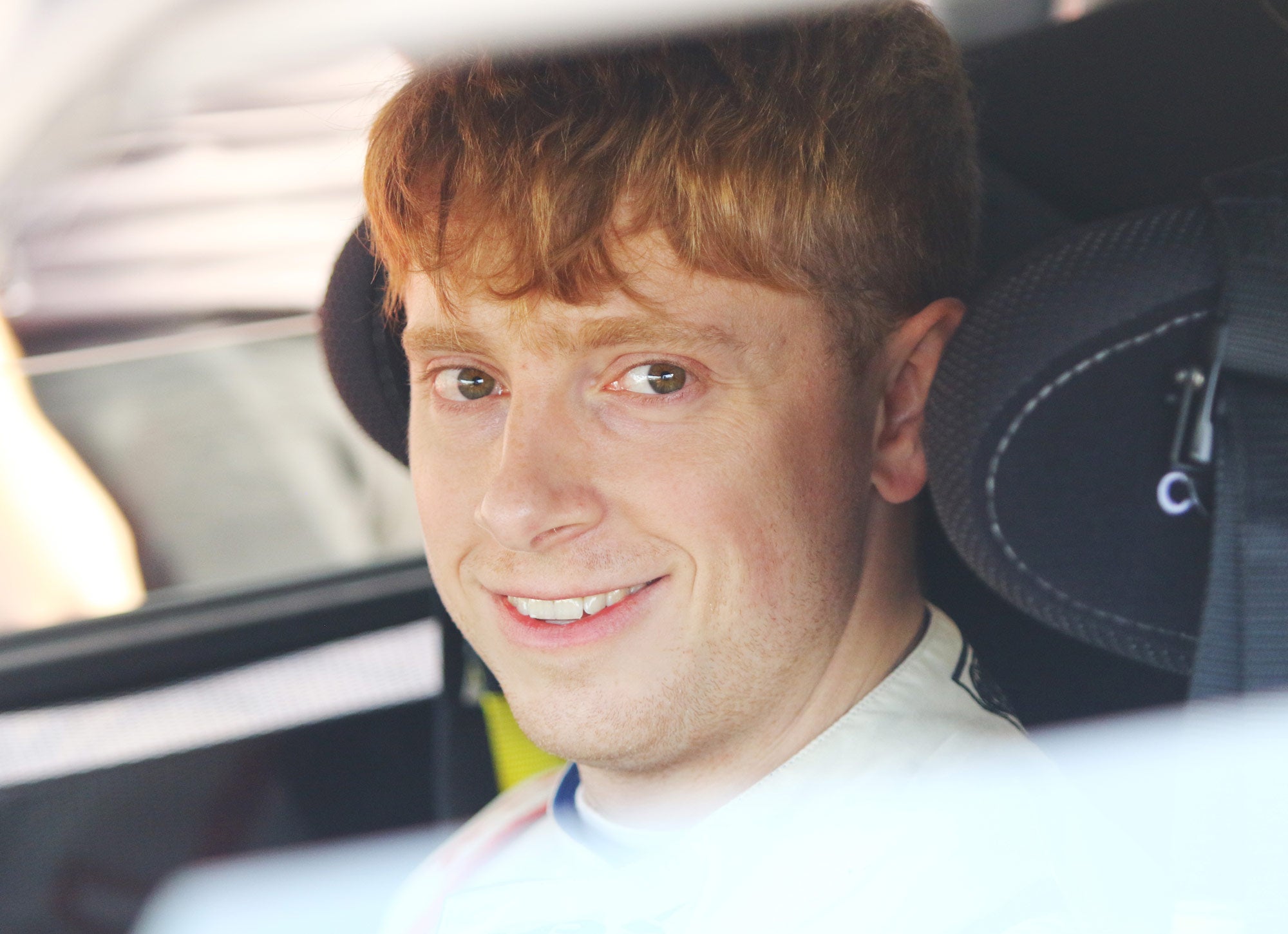 Bradley Gravett son of BTCC British Touring Car Champion Robb Gravett in the MINI Challenge JCW Series at Silverstone sat in car smiling at the camera Driver LIQUI MOLY LM Performance Thinking it Better Scalextric Elite Vehicle Chargers DriverAssist.me