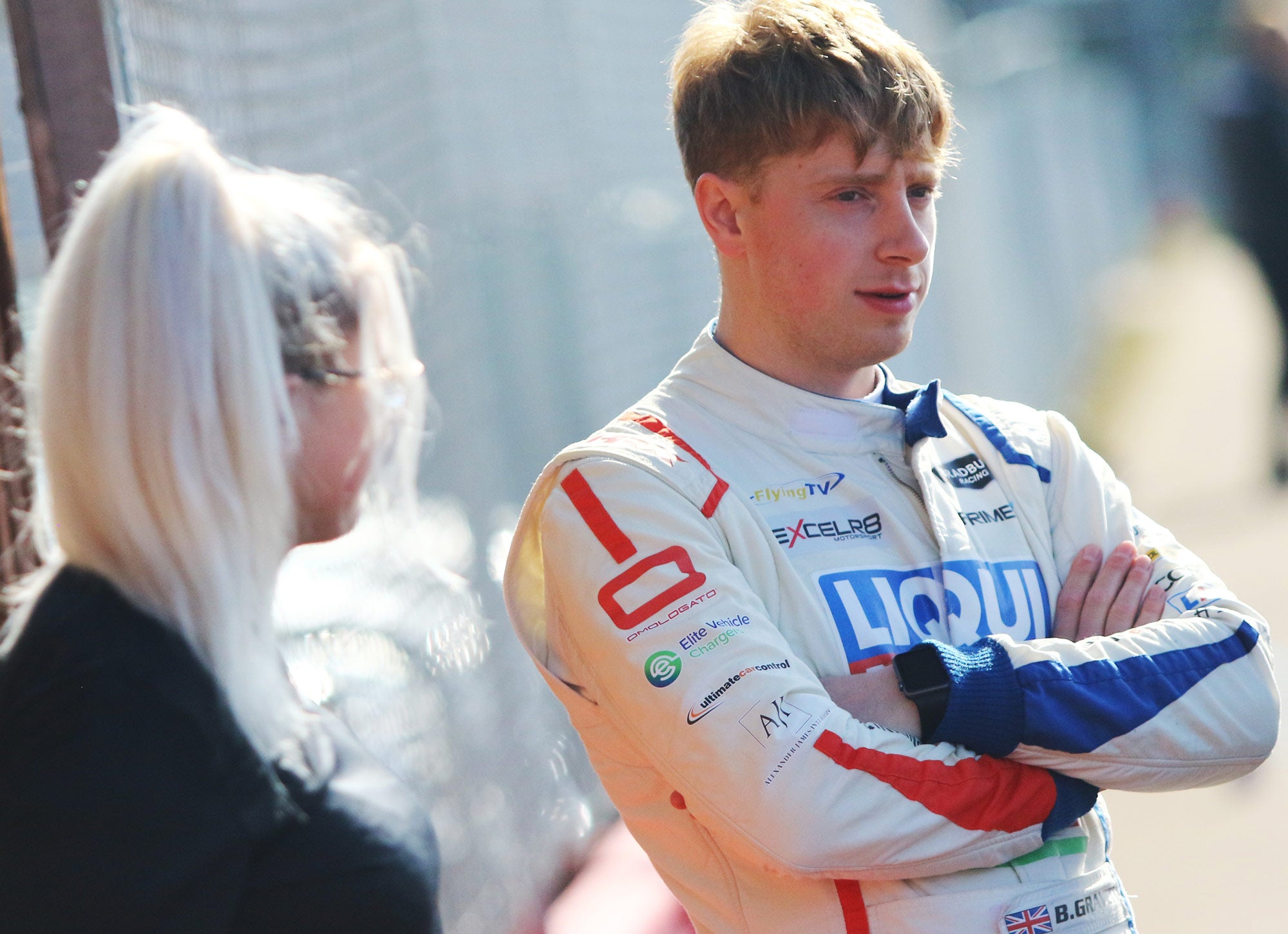 Bradley Gravett son of BTCC British Touring Car Champion Robb Gravett in the MINI Challenge JCW Series at Silverstone standing in pit lane Racing Driver LIQUI MOLY LM Performance Thinking it Better Scalextric Elite Vehicle Chargers