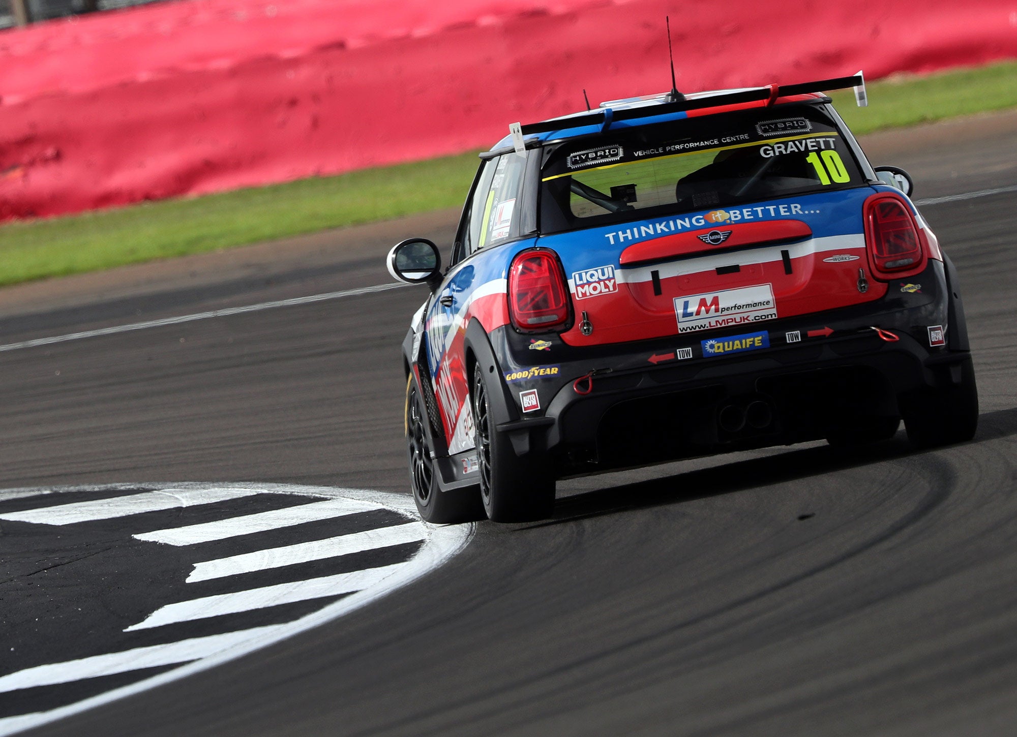 Bradley Gravett son of BTCC British Touring Car Champion Robb Gravett in the MINI Challenge JCW Series at Silverstone with EXCELR8 Motorsport turning into Brooklands corner Cooper Racing Driver LIQUI MOLY LM Performance Thinking it Better