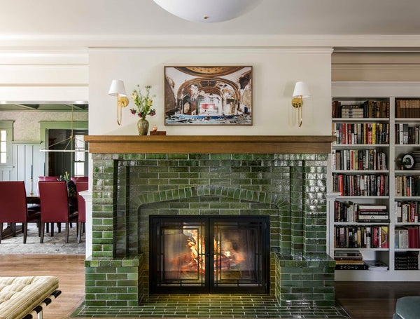 cozy fireplace and dining room with vintage rug