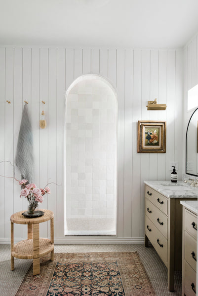 bathroom with vintage rug and handmade tile