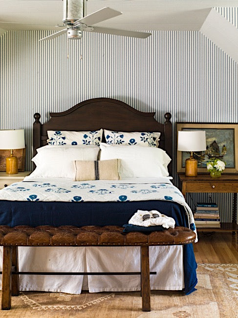 bedroom with blue stripe wallpaper