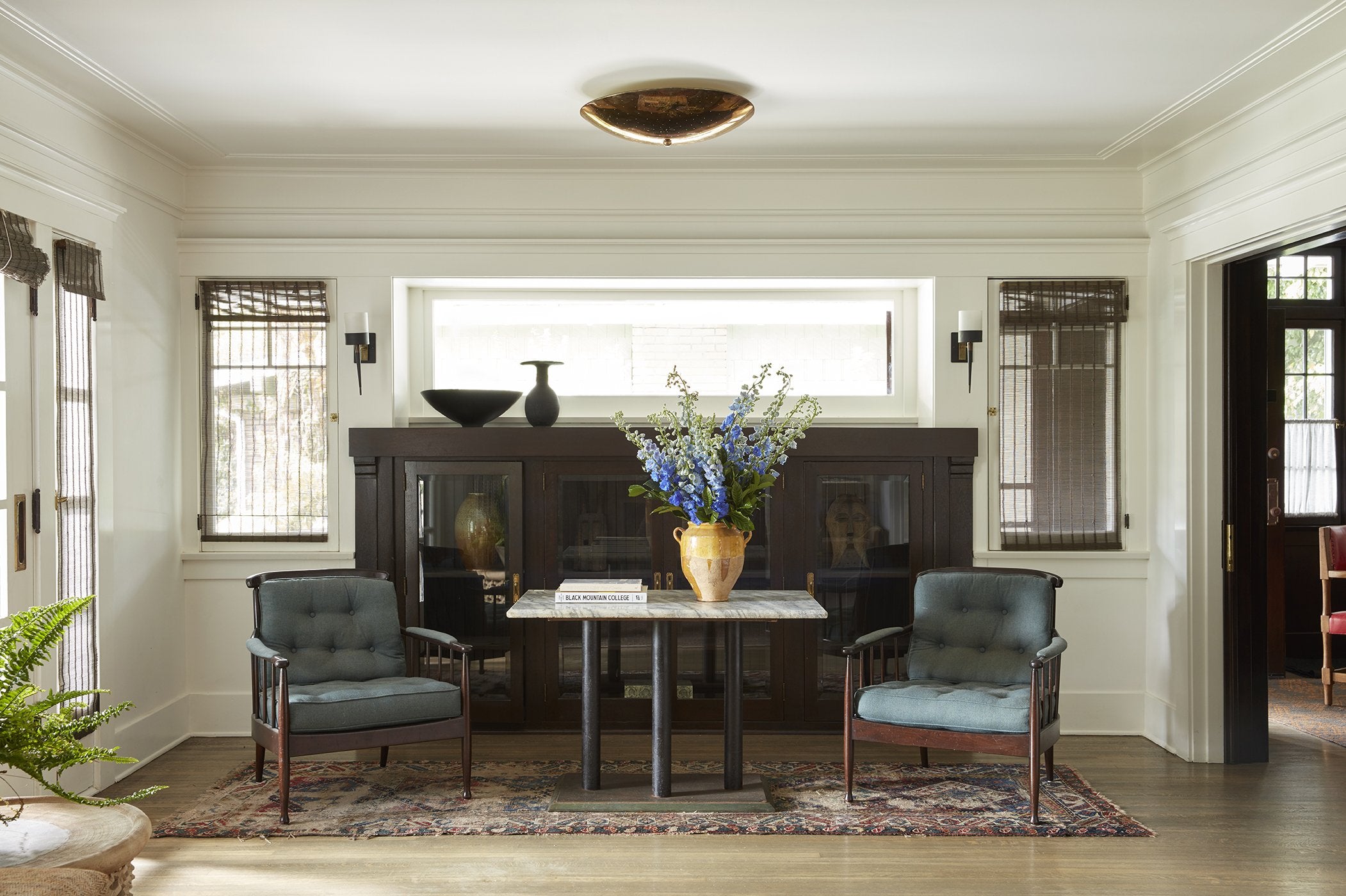 vintage rug with pair of chairs