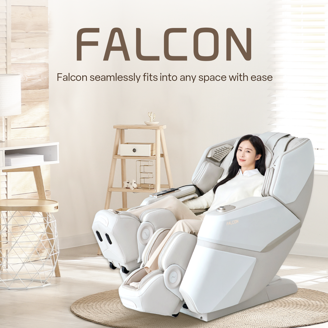 In a modern space, a Falcon massage chair is placed, and a woman is sitting in the massage chair.