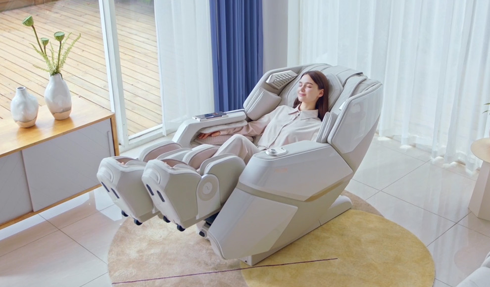 A photo of a woman comfortably seated and enjoying a massage in the Falcon massage chair.