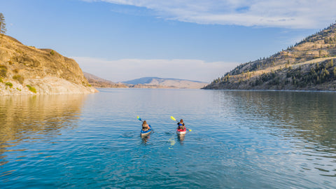 Caribbean sit-on-top kayaks on a lake