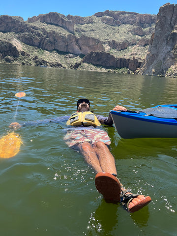 Seth floating in the water, Canyon Lake.