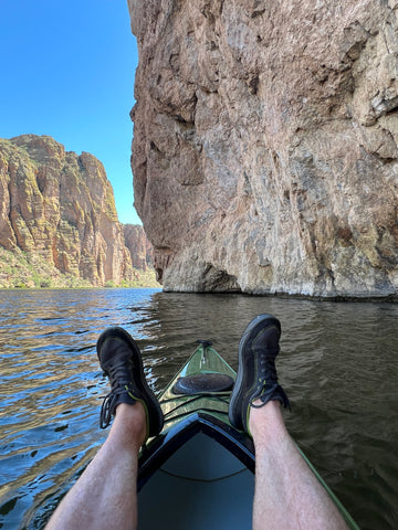 Dan resting his feet on the bow of his Sandpiper 130.