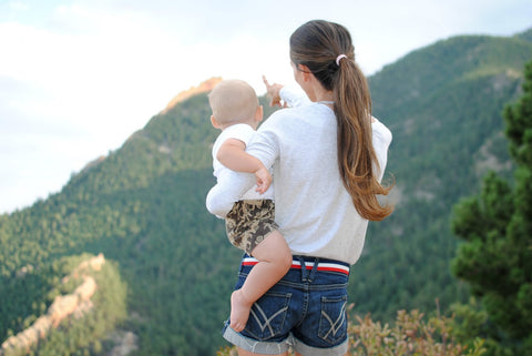 Mom and child looking out onto scenery