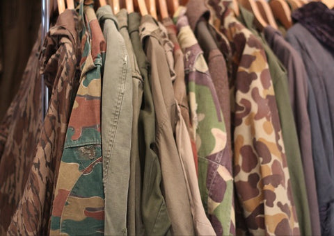 Image of vintage camo jackets, Photo courtesy of https://denimhunters.com/the-impact-of-vintage-military/