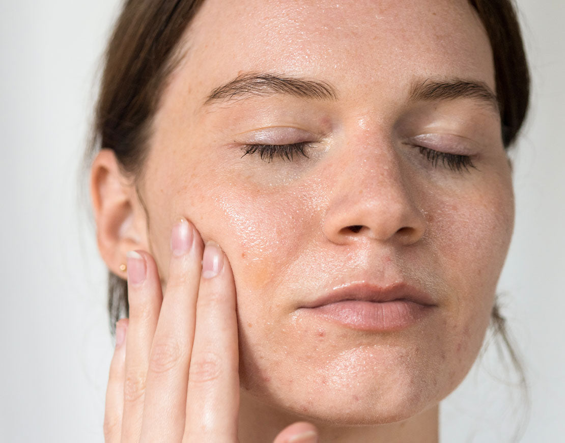 Person cleansing their face