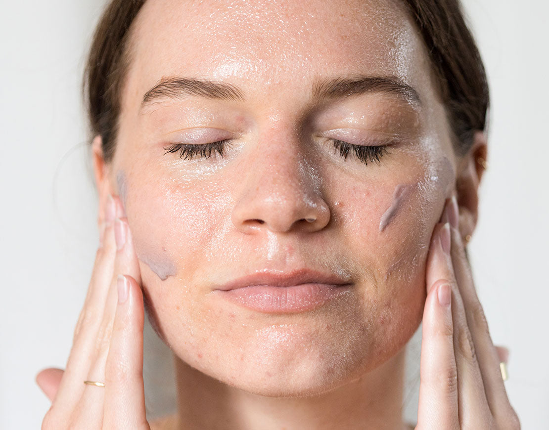 Person cleansing their face