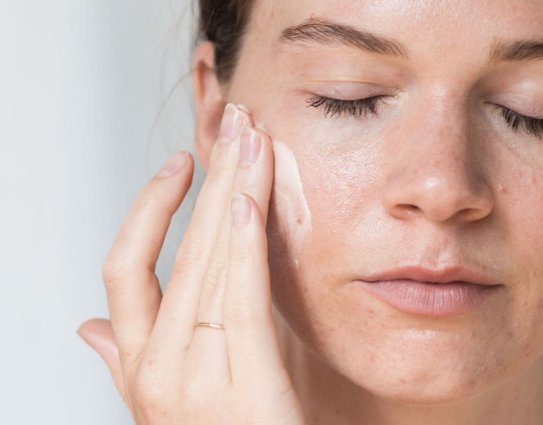 Person applying face cream