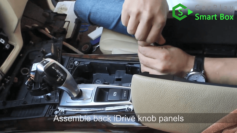 12.Assemble back iDrive knob panels.