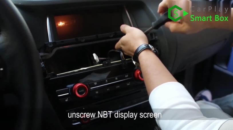 2. Unscrew NBT display screen - Step by Step BMW X3 F25 X4 F26 NBT Wireless CarPlay Installation - CarPlay Smart Box