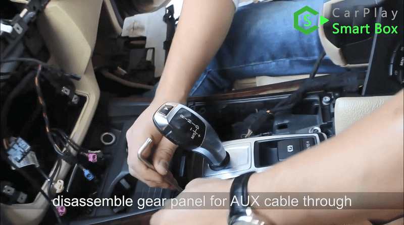 8.Disassemble gear panel for AUX cable through.