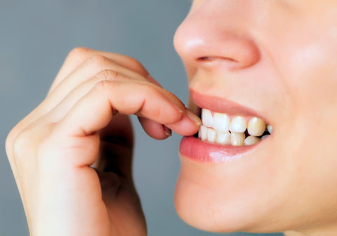 person biting their nails