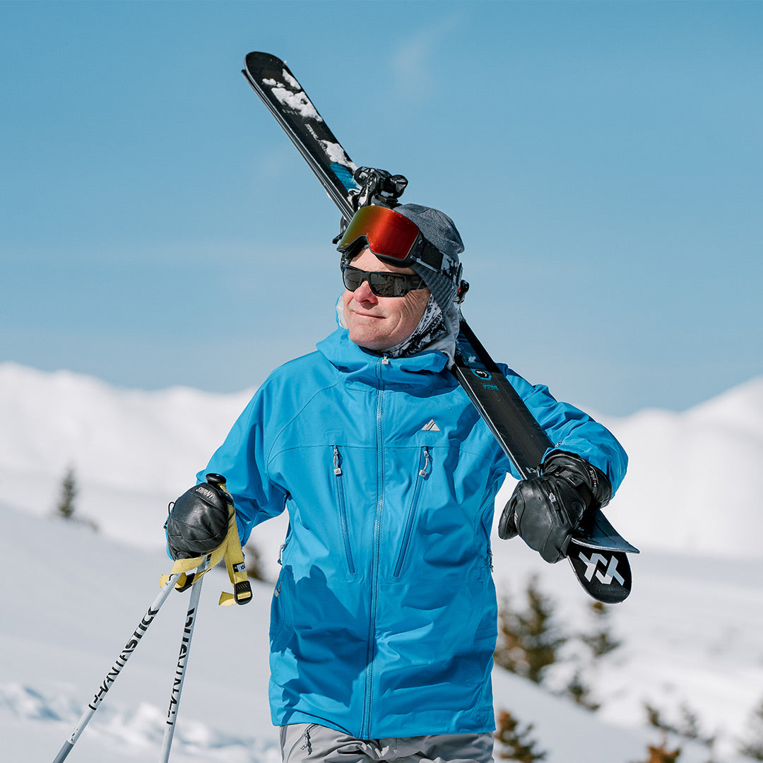 skier hiking in the cobalt pyramid jacket