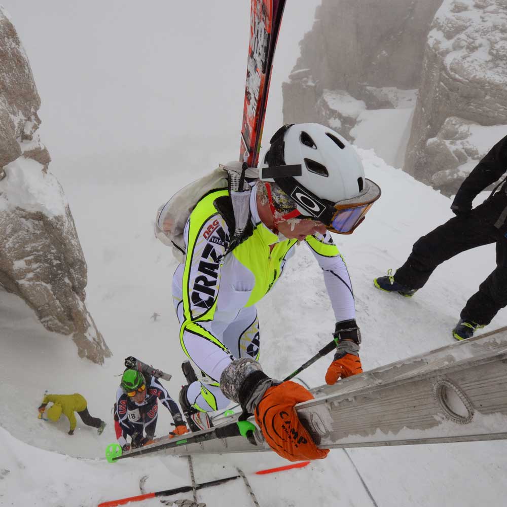 John Gaston climbing ladder during skimo race in Europe