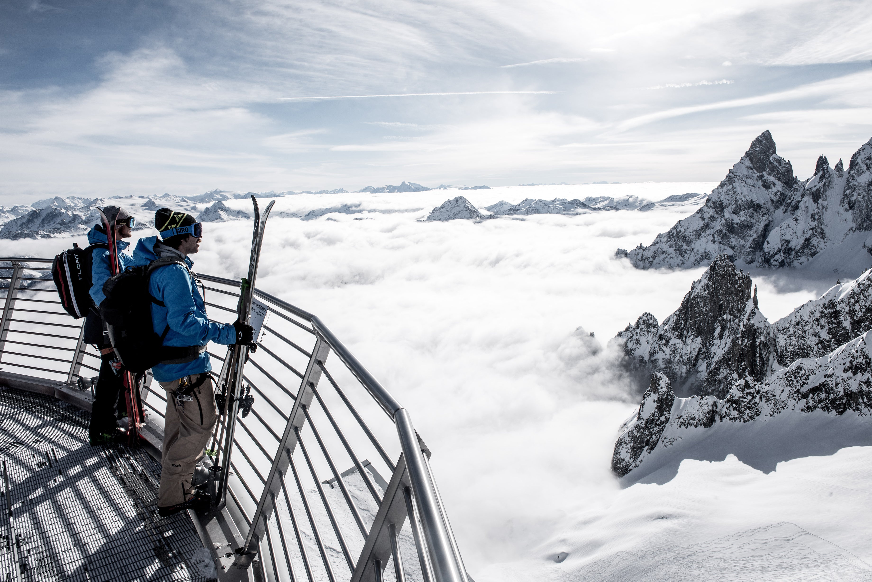 Skiers peer over abyss