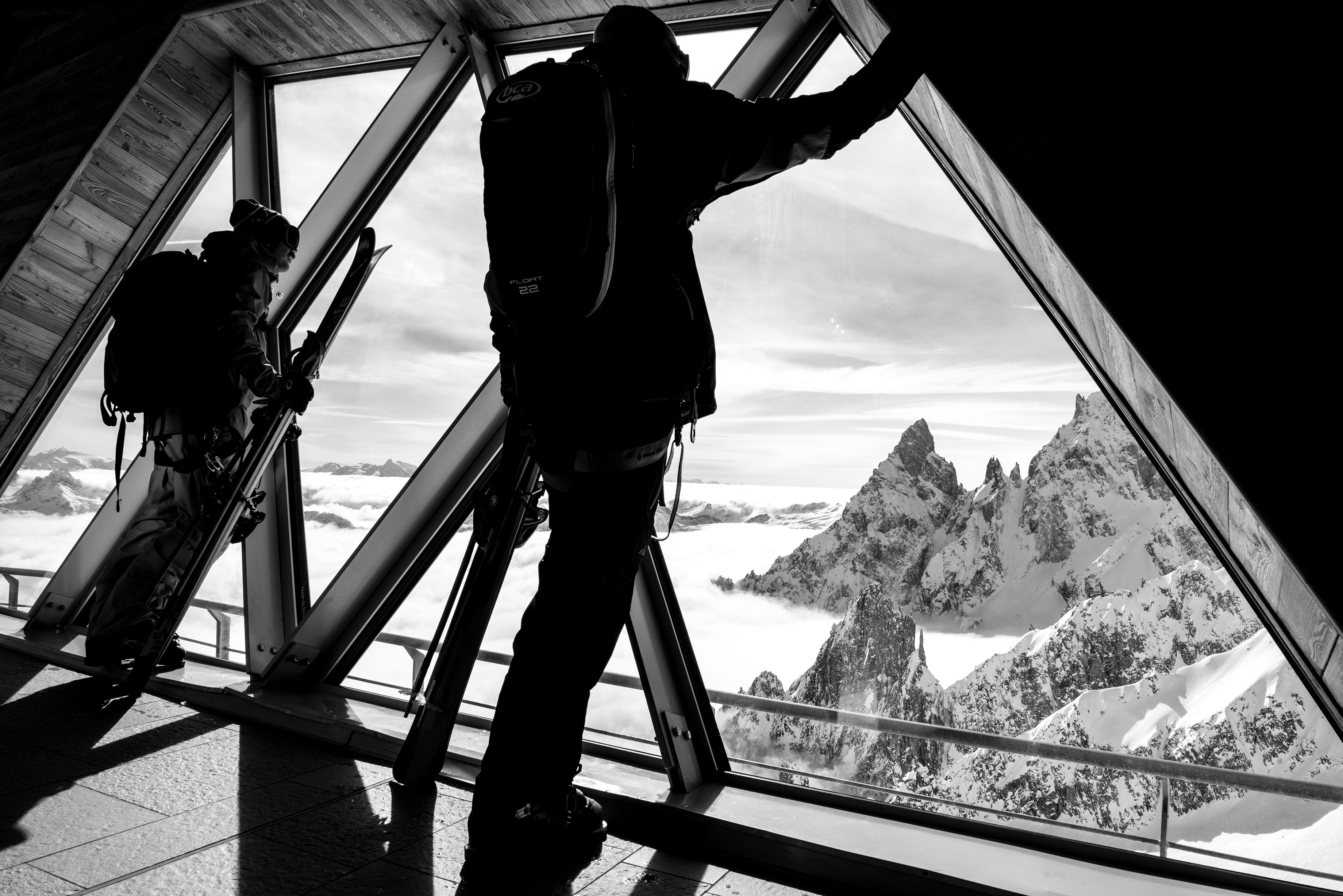 Skiers look out more tram station windows