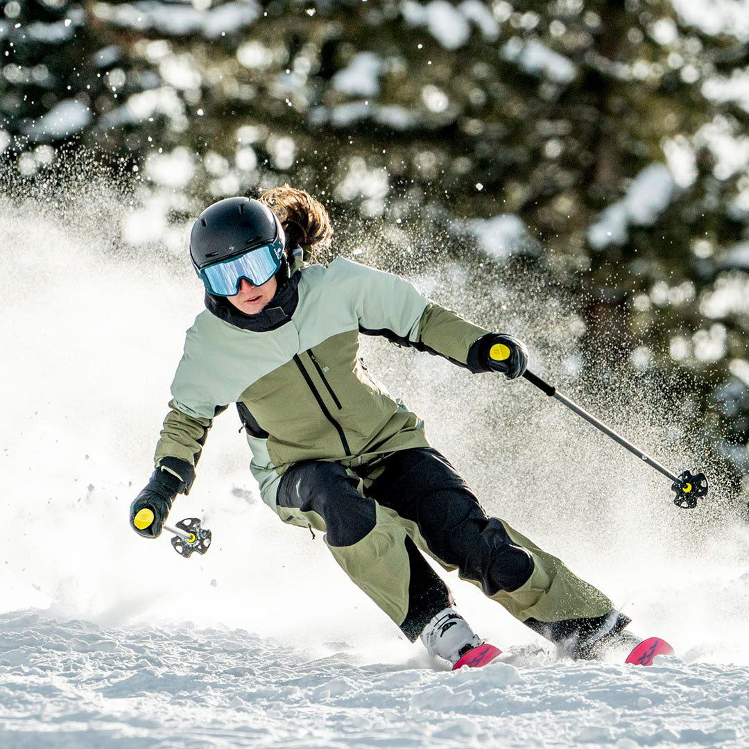 backlit ski turn in the leafy scarlett bib