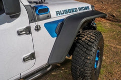 Close-up shot on the right side of a Jeep Wrangler fender and tire