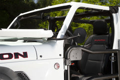 Side image of a black rectangular trail mirror bolted to the windshield of a white Jeep Wrangler JL