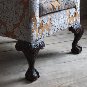 19th century wing back arm chair with ball and claw legs