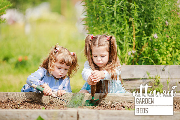 raised garden beds girls digging