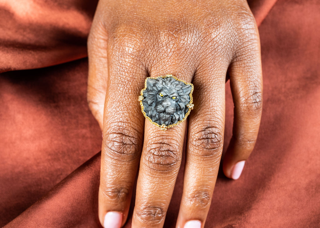 Picture of a model holding an obsidian lion ring