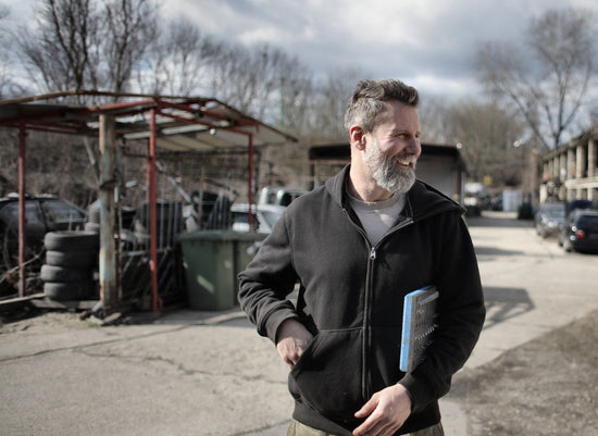 a general contractor holding a notepad