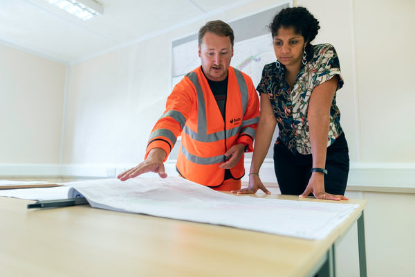 a contractor reviewing a house plan 