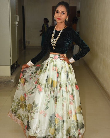 Suvidha wearing a white floral pleated skirt designed from our Organza Fabric Collection. 4 meters of fabric was used in making this garment.