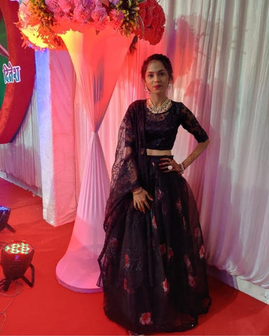 Suvidha wearing a black pleated skirt designed from our Organza Fabric Collection.