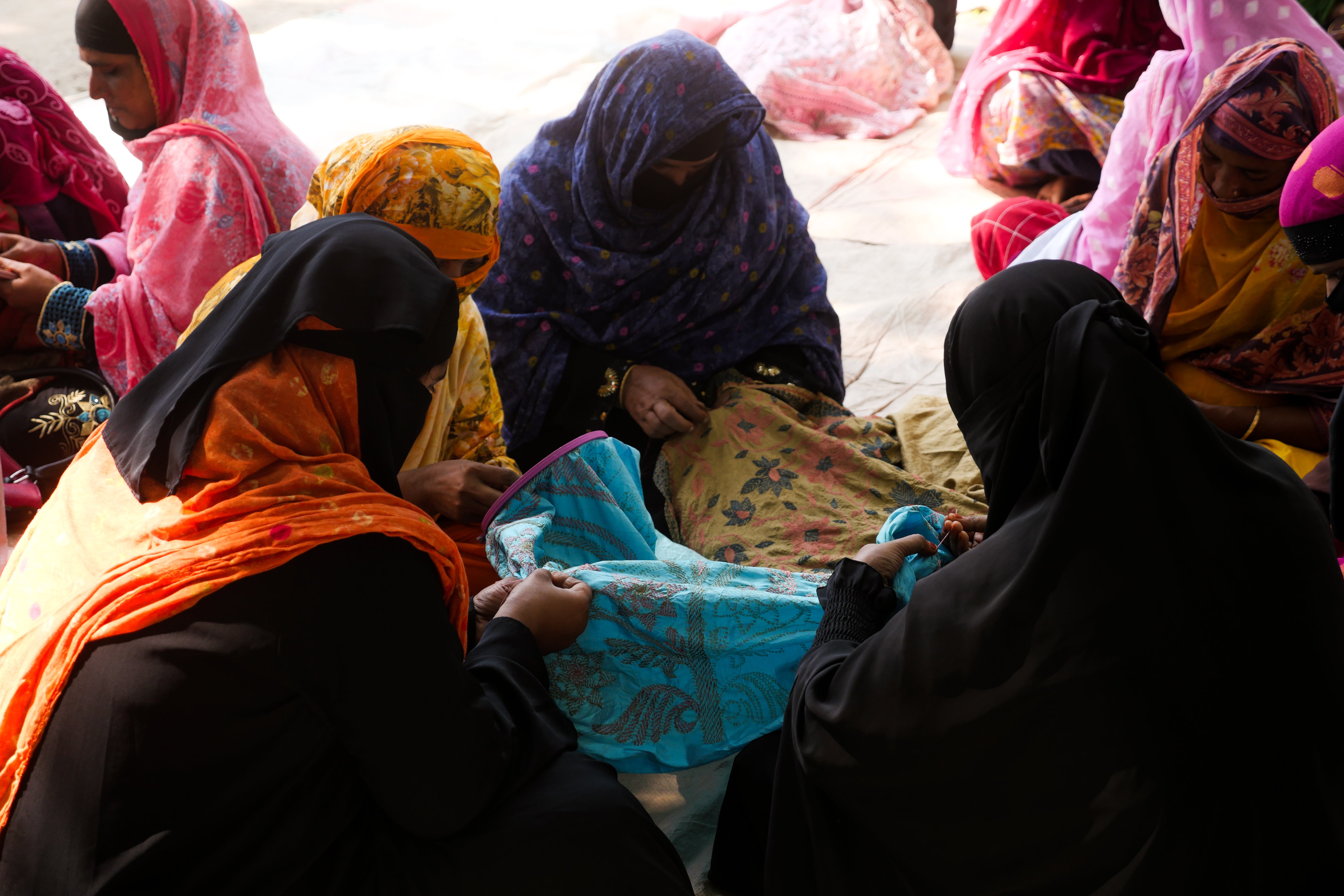 Part of a cluster of women working on a kantha near Jessore Bangladesh. Photo by Fiona Cameron